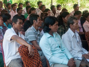 Rural Cambodians listen to info on passports provided by data journalists (photo: Kyle James) 