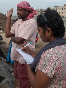 Pramila taking notes for a story