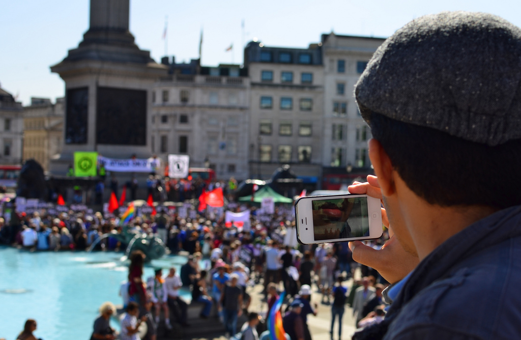 Photo of mobile phone recording protest