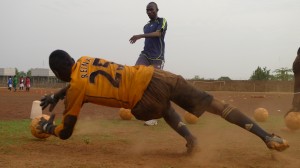 Abubakari Yussif kicks the ball to a goalie
