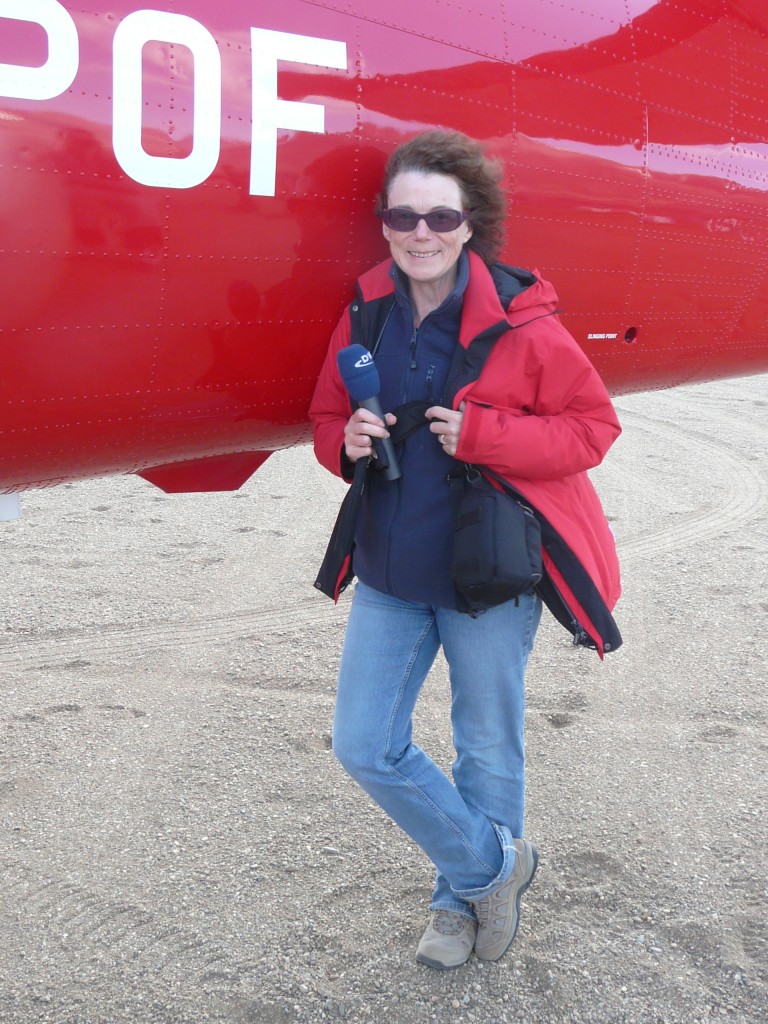 Ice blogger Irene Quaile shelters from the wind at Zackenberg station, High Arctic Greenland